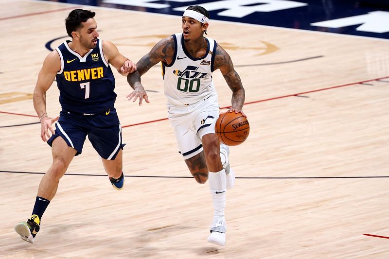 Facundo Campazzo #7 of the Denver Nuggets defends against Jordan Clarkson #00 of the Utah Jazz.