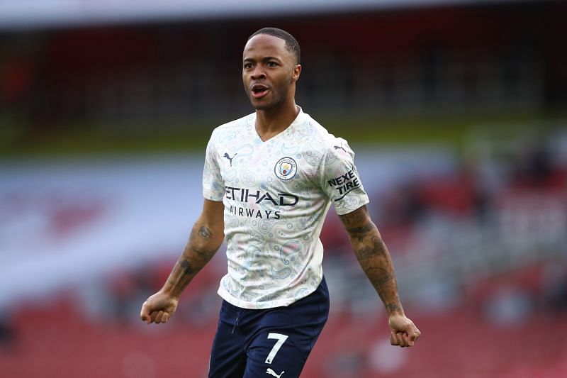 Raheem Sterling celebrates after scoring the opener for Manchester City against Arsenal.