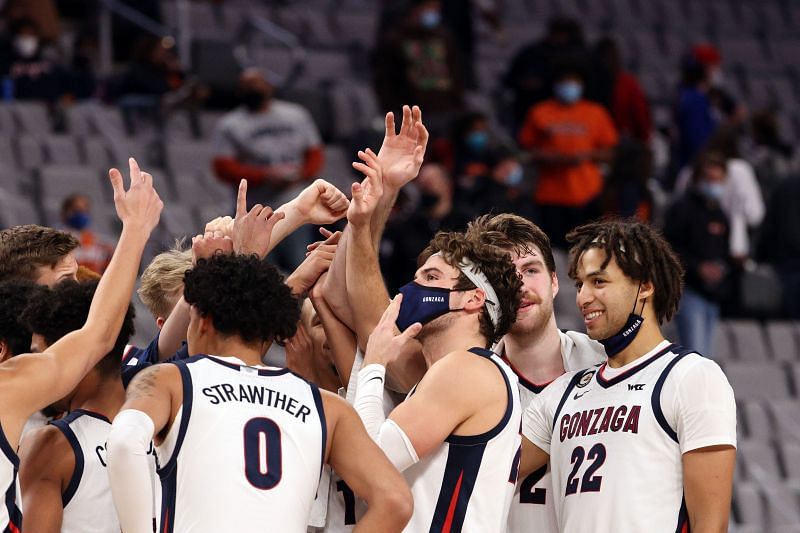 The Gonzaga Bulldogs celebrate a 98-75 win against the Virginia Cavaliers