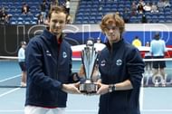 Daniil Medvedev and Andrey Rublev pose with the ATP Cup trophy