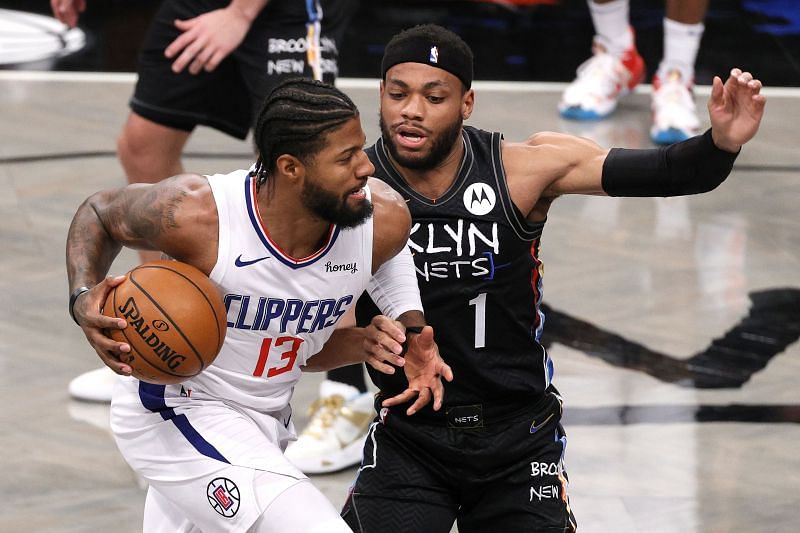 Paul George #13 of the LA Clippers drives toward the basket as Bruce Brown #1 of the Brooklyn Nets defends.