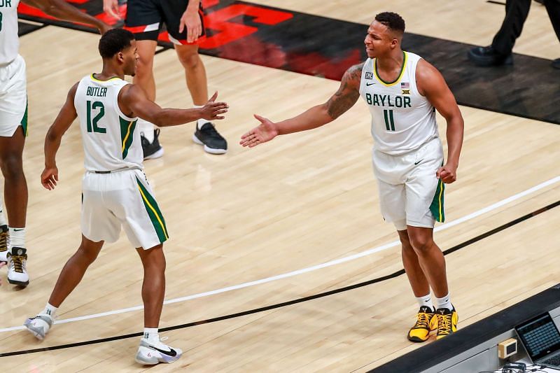 Guards Mark Vital #11 and Jared Butler #12 of the Baylor Bears high five