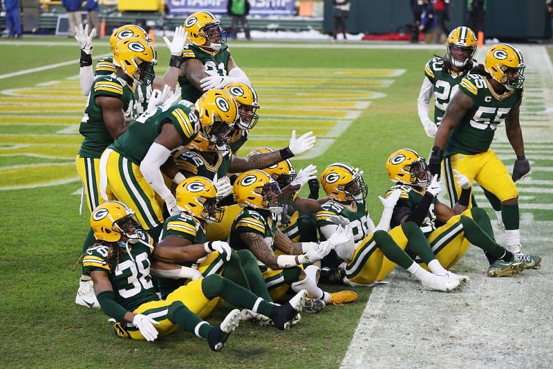 Green Bay Packers defense celebrates after intercepting Tom Brady in NFC Championship Game