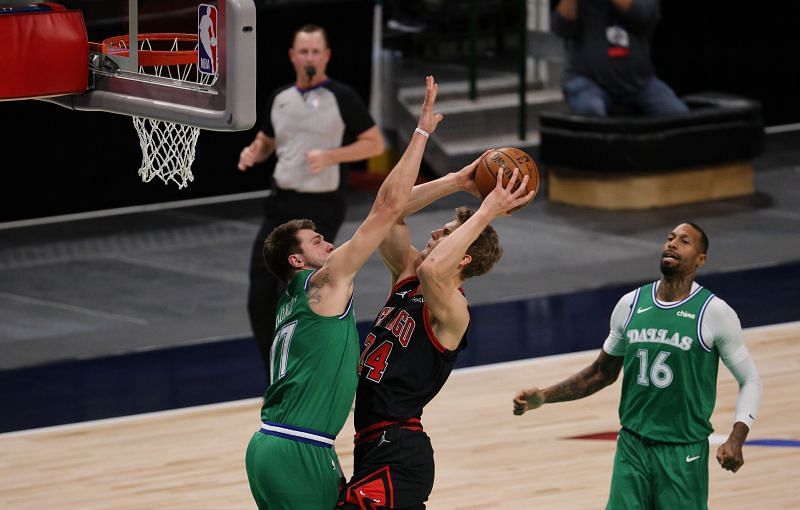 Luka Doncic #77 of the Dallas Mavericks fouls Lauri Markkanen #24 of the Chicago Bulls in the first quarter at American Airlines Center on January 17, 2021 in Dallas, Texas. (Photo by Ronald Martinez/Getty Images)