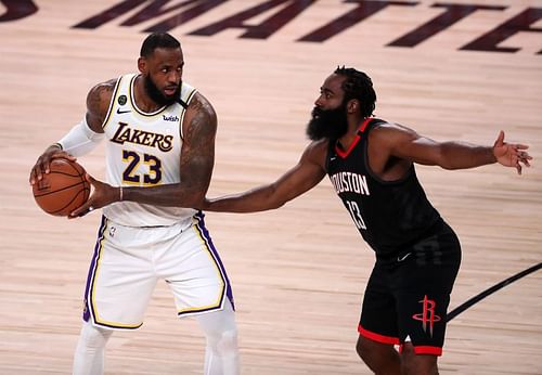 LeBron James of the Los Angeles Lakers drives the ball against James Harden of the Houston Rockets in the Western Conference Second Round during the 2020 NBA Playoffs (Photo by Michael Reaves/Getty Images)