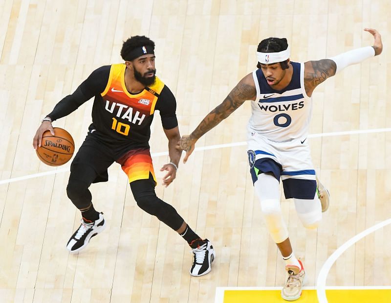 D&#039;Angelo Russell #0 of the Minnesota Timberwolves guards Mike Conley #10 of the Utah Jazz