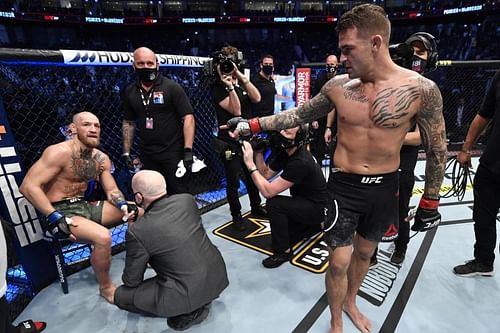 Conor McGregor (on the stool) sustained damage to his peroneal nerve during his fight against Dustin Poirier (standing) at UFC 257