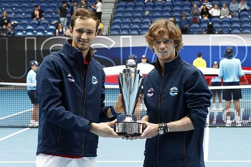 Daniil Medvedev and Andrey Rublev with the ATP Cup trophy