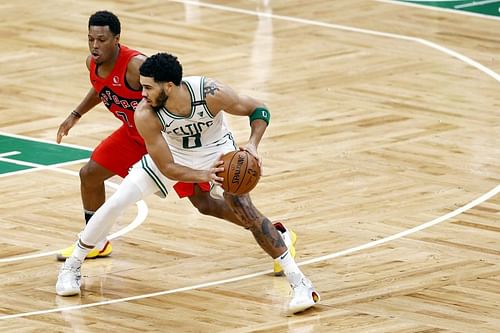 Kyle Lowry #7 of the Toronto Raptors defends Jayson Tatum #0 of the Boston Celtics