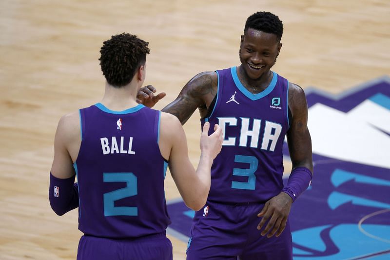 Terry Rozier (#3) of the Charlotte Hornets celebrates with teammate LaMelo Ball (#2) 