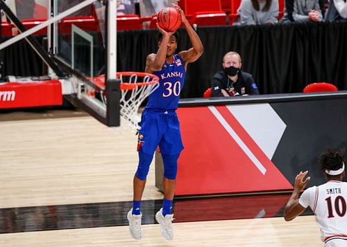 Kansas Guard Ochai Agbaji #30 shoots a three-pointer