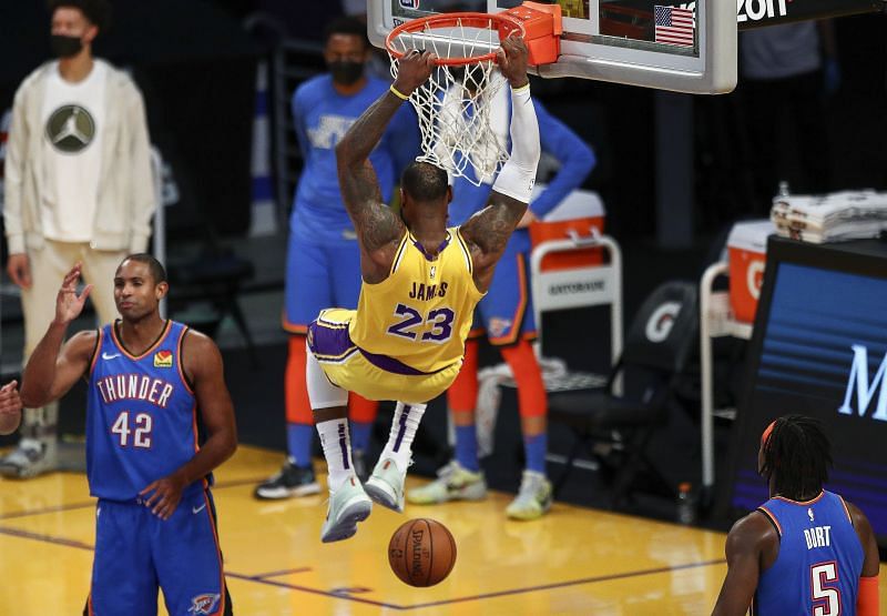 LeBron James #23 of the Los Angeles Lakers dunks in overtime against the Oklahoma City Thunder at Staples Center on February 08, 2021 in Los Angeles, California. (Photo by Meg Oliphant/Getty Images)