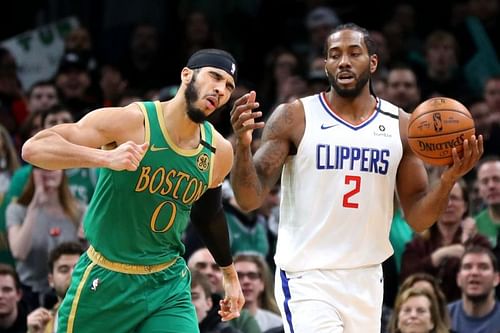 Jayson Tatum #0 of the Boston Celtics celebrates as Kawhi Leonard #2 of the LA Clippers