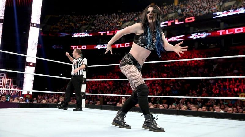 Paige mocks Ric Flair.