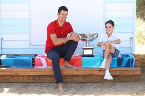 Novak Djokovic with a young tennis fan after winning the 2021 Australian Open