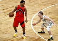 Payton Pritchard #11 of the Boston Celtics defends Kyle Lowry #7 of the Toronto Raptors during the second quarter at TD Garden on February 11, 2021 in Boston, Massachusetts.