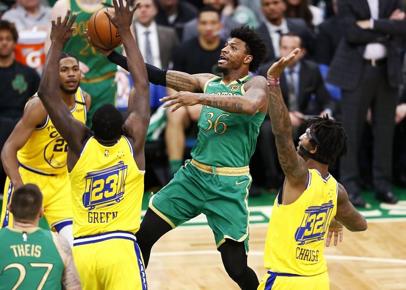 Marcus Smart of the Boston Celtics drives to the basket during the second quarter of the game against the Golden State Warriors at TD Garden