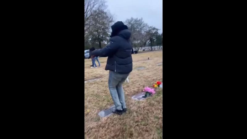 Adult male doing a zombie walk towards the tombstone (Image Via YouTube/Pegasus)