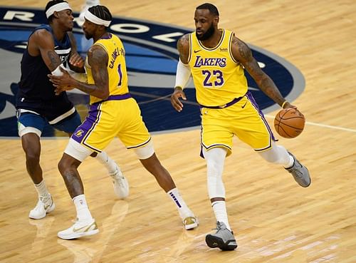 Kentavious Caldwell-Pope #1 of the Los Angeles Lakers sets a pick for Jarred Vanderbilt #8 of the Minnesota Timberwolves as teammate LeBron James #23 dribbles past during the first quarter of the game at Target Center on February 16, 2021 (Photo by Hannah Foslien/Getty Images)