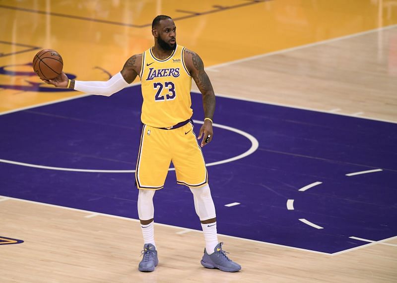 LeBron James #23 of the Los Angeles Lakers directs his team