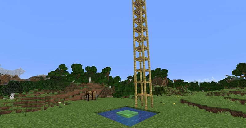 A mini trampoline set up in Minecraft with a slime block and scaffolding. (Image via Minecraft)
