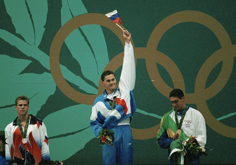 Alexander Popov of Russia (C) celebrates winning the gold medal in the Men&#039;s 100 metre freestyle competition ahead of second placed Gary Hall Jr (L) and third placed Gustavo Borges during the XXVI Summer Olympic Games in Atlanta, Georgia.