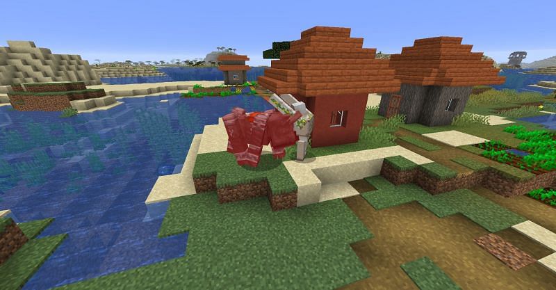 An Iron Golem fighting a Ravager in Minecraft. (Image via Minecraft)