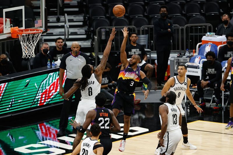 The Phoenix Suns&#039; Chris Paul goes up against the Brooklyn Nets