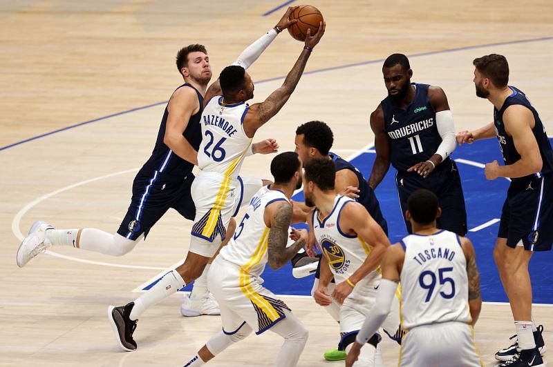 Kent Bazemore of the Golden State Warriors against Luka Doncic of the Dallas Mavericks