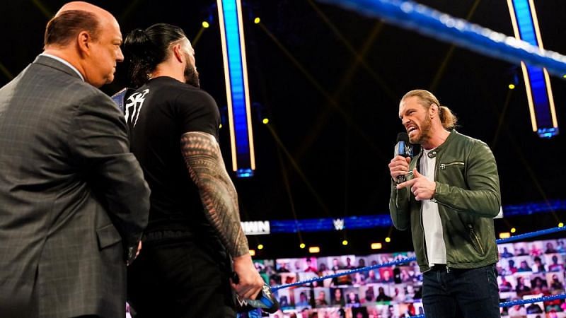 Edge confronting Roman Reigns