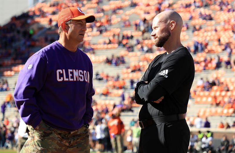 Wofford head coach Josh Conklin speaks with Clemson head coach Dabo Swinney.