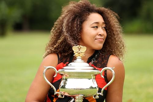 Naomi Osaka poses with the 2021 Australian Open trophy