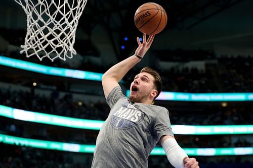 Luka Doncic #77 of the Dallas Mavericks works through pregame warmup