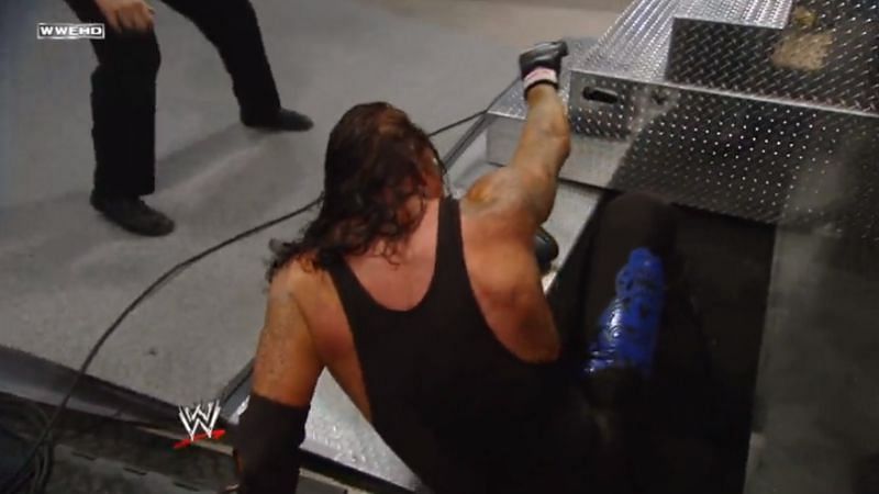 The Undertaker moments after his fall through the door