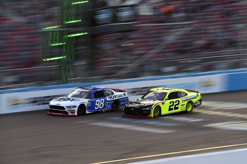 Chase Briscoe (98) fends off 2020 NASCAR Xfinity Series champion Austin Cindric (22) at the season finale in Phoenix.