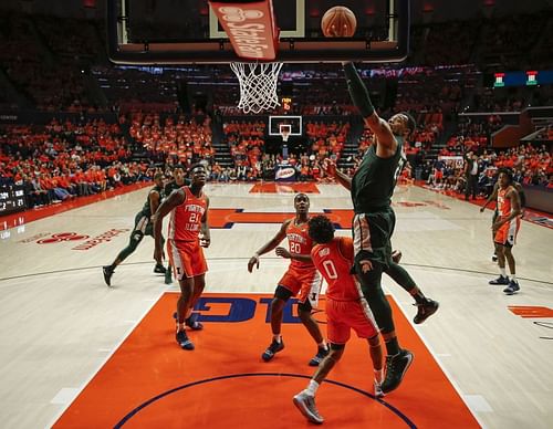 The Michigan State Spartans shoot the ball over Alan Griffin #0 of the Illinois Fighting Illini