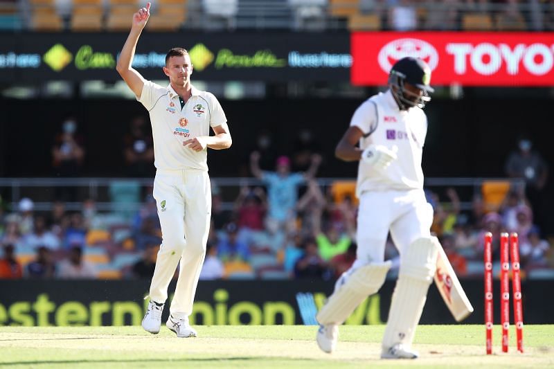 Siraj walks back to the pavilion after being bowled by Hazlewood