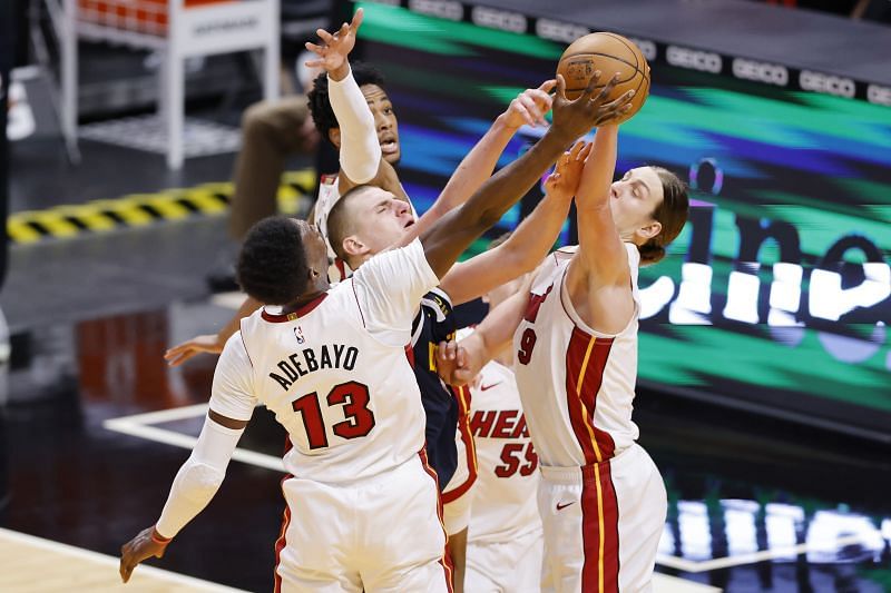 Miami Heat Bam Adebayo #13 and Kelly Olynyk #9 of the Miami Heat defend a shot