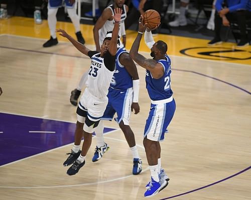 Jarrett Culver of the Minnesota Timberwolves guards LeBron James of the Los Angeles Lakers.