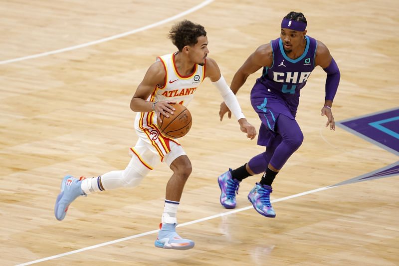 NBA DFS option Trae Young #11 of the Atlanta Hawks brings the ball up court