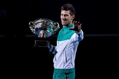 Novak Djokovic poses with the 2021 Australian Open