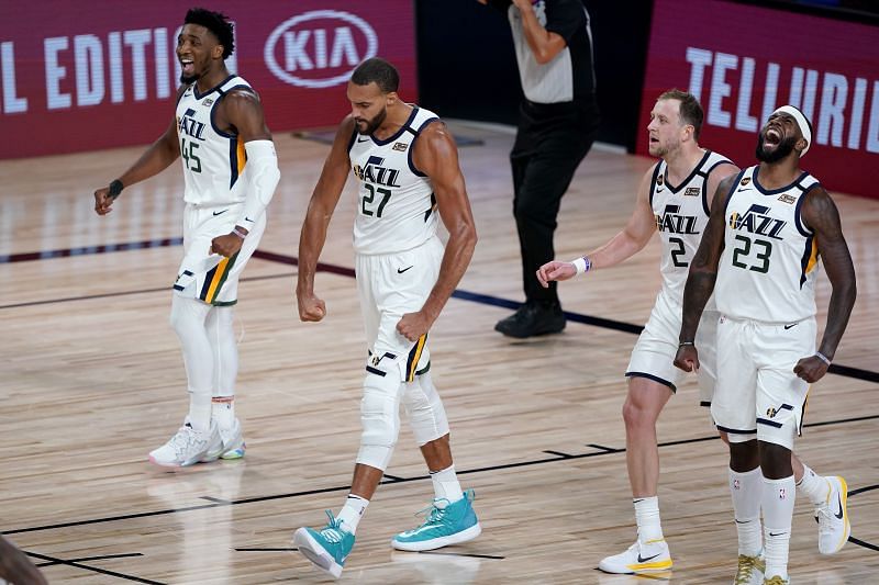 Rudy Gobert #27 of the Utah Jazz celebrates a defensive stop with teammates Royce O'Neale #23, Joe Ingles #2 and Donovan Mitchell #45