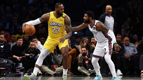 Kyrie Irving guards LeBron James as the Brooklyn Nets host the LA Lakers