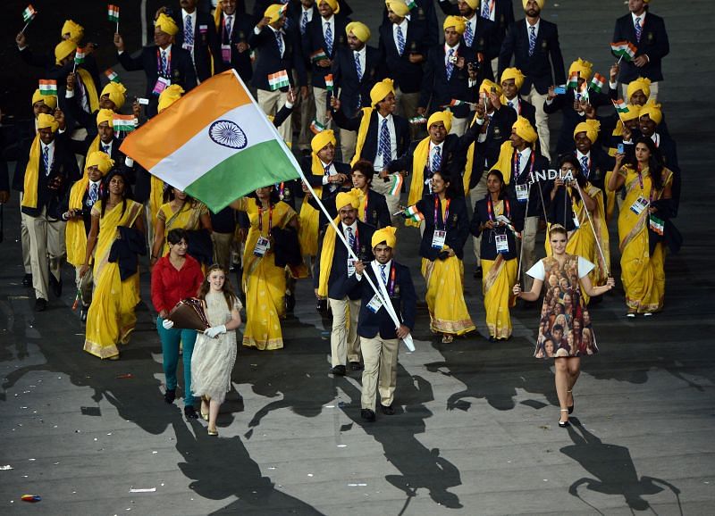 Sushil Kumar carries his country&#039;s flag during the opening ceremony at London Olympics.
