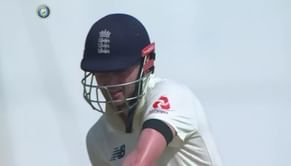 Why are the England players wearing black armbands?