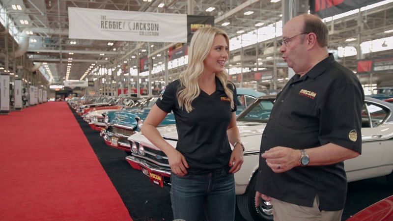 Katie Osbourne with Mecum Auction car expert John Kraman. Photo: Mecum Auctions