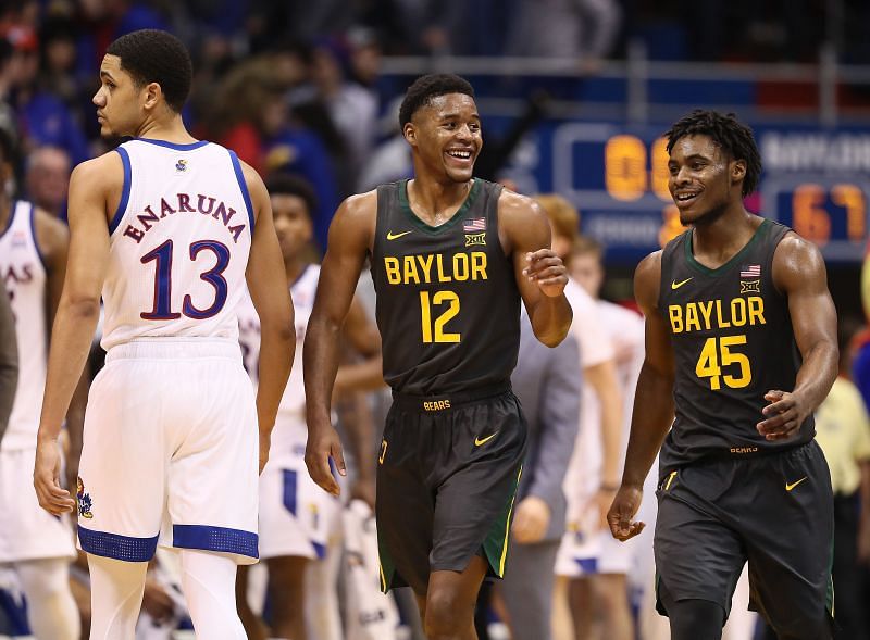 Jared Butler #12 and Davion Mitchell #45 of the Baylor Bears smile as Baylor defeats the Kansas Jayhawks