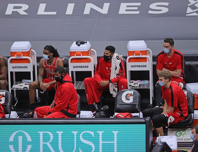 Members of the Chicago Bulls watch the end of the game against the Indiana Pacers from the bench at the United Center