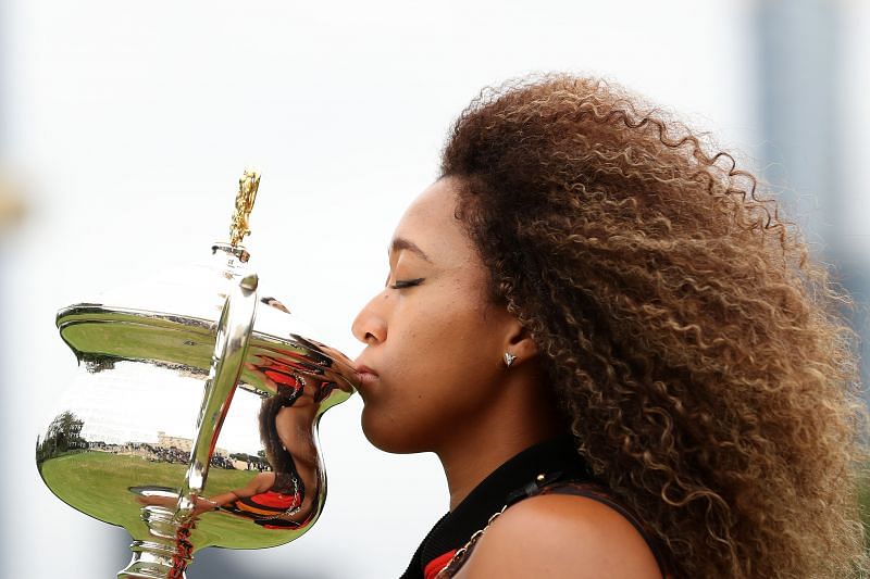 Naomi Osaka kisses the Daphne Akhurst Memorial Trophy after winning the 2021 Australian Open
