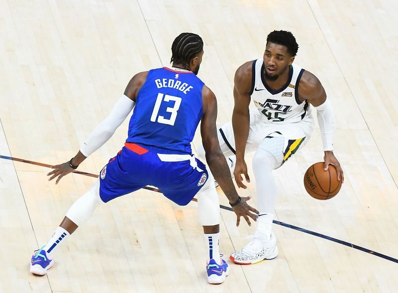 Utah Jazz&#039;s Donovan Mitchell goes up against Paul George of the LA Clippers